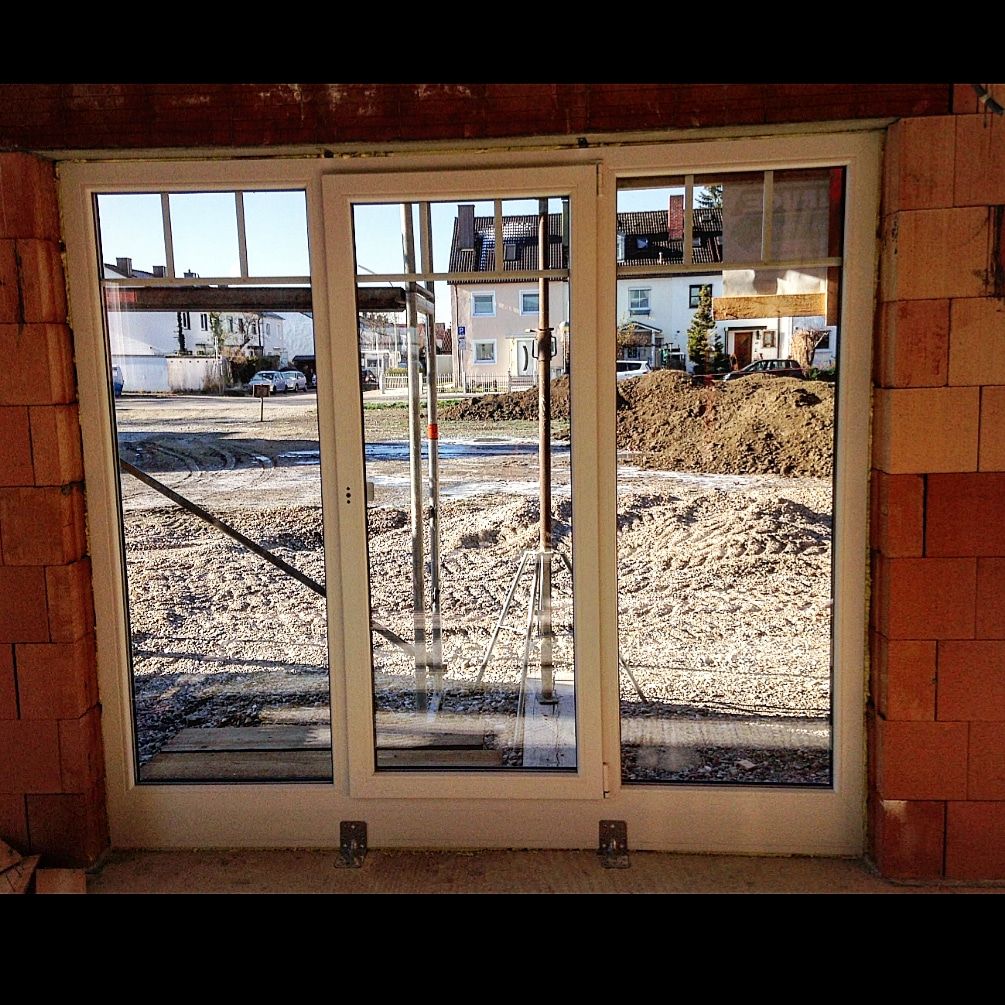 Window frame fixed into a brick opening with MULTIFOAM PU foam, before finishing